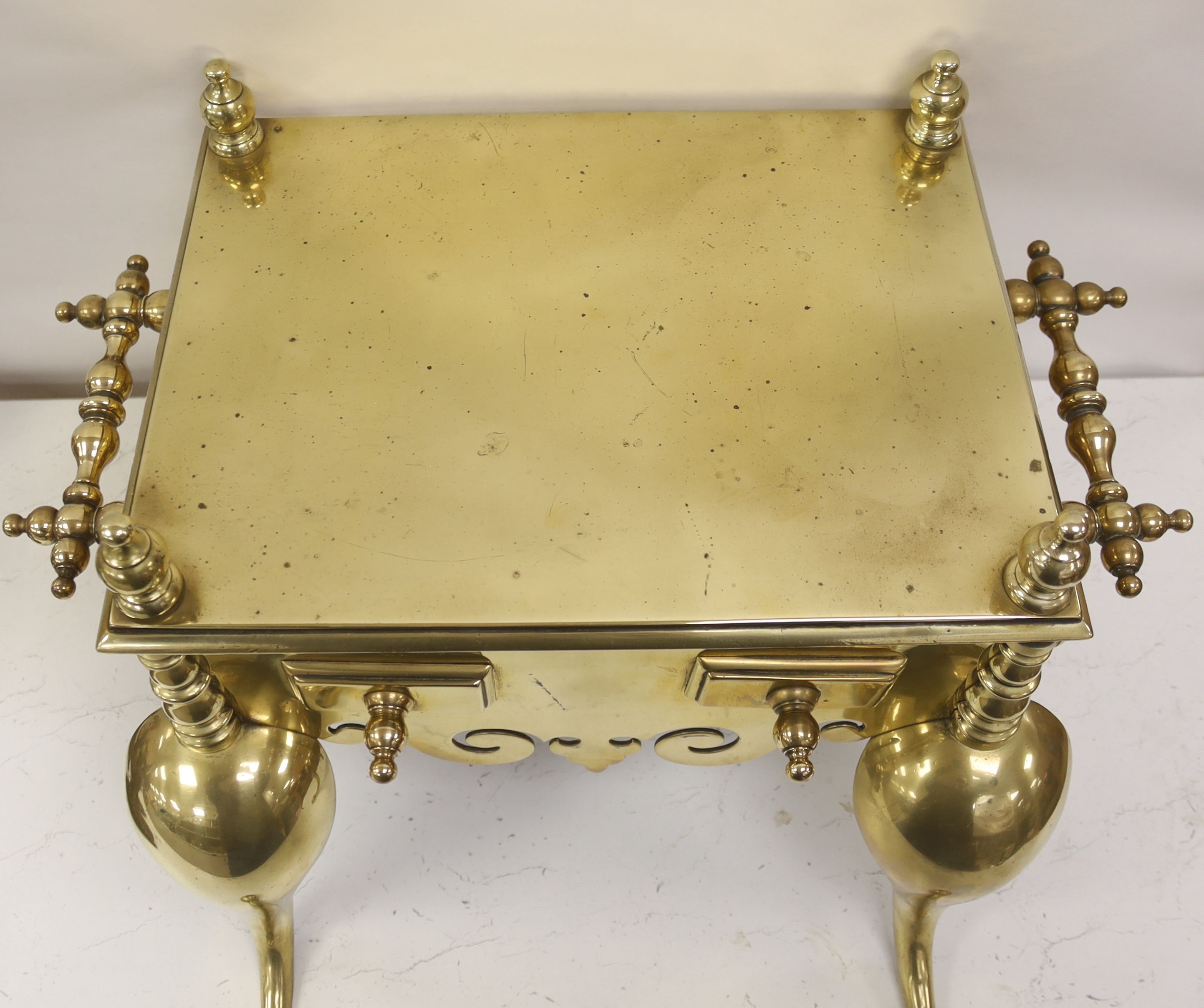 A Georgian brass footman, 55cm wide